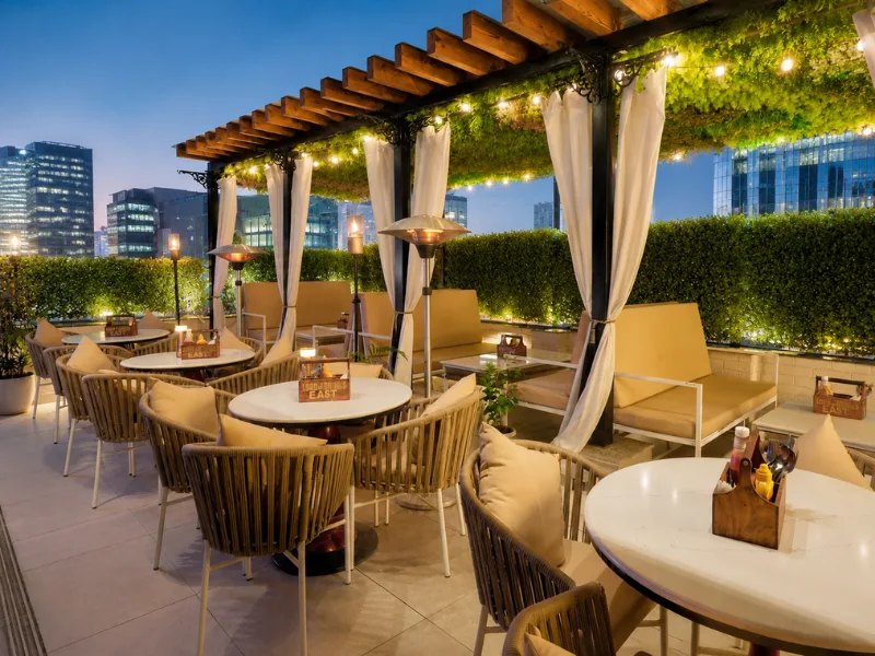 Outdoor restaurant furniture set in Noida featuring weather-resistant dining chairs and table