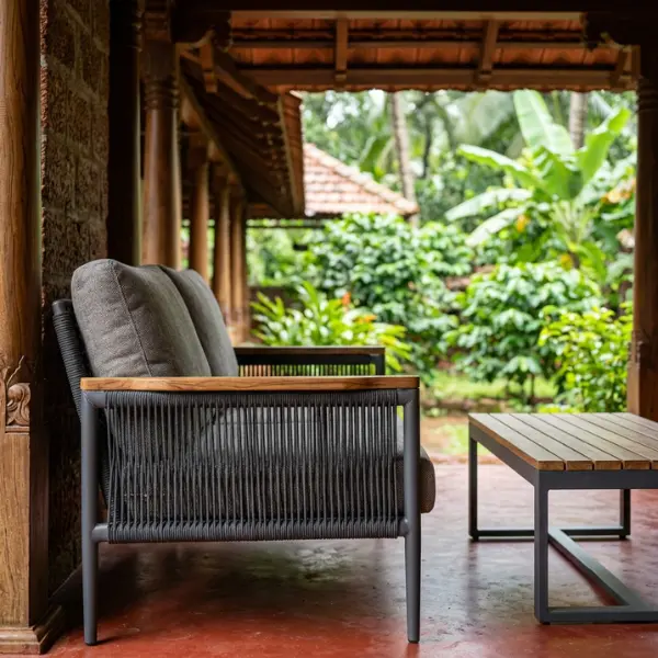 Premium heritage homestay furniture offering a classic Kerala aesthetic to Wayanad resorts.