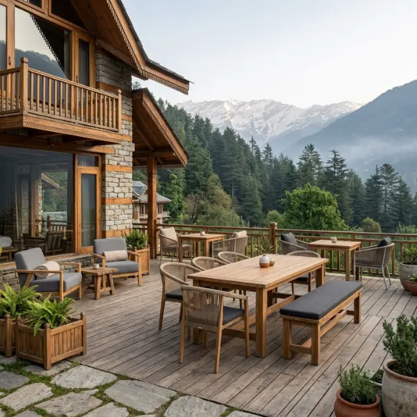 Beautifully crafted homestay boutique guesthouse furniture set up on a snowy balcony in Manali
