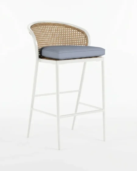 Marine-grade bellamy bar stool with crisp white powder-coated frame and natural synthetic cane weave
