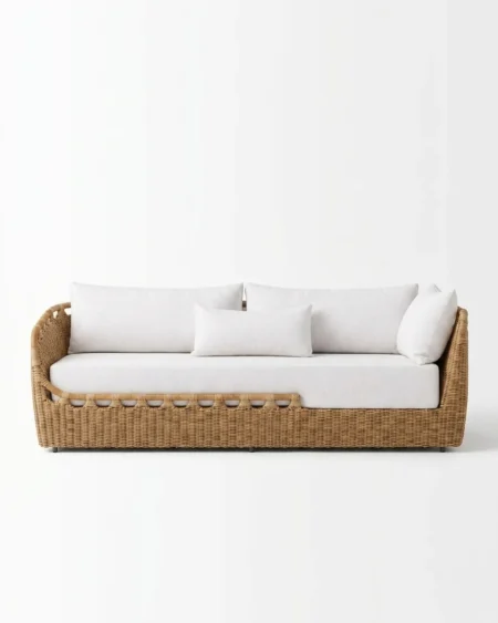 The Coastal Rattan Weave Sofa featuring a sophisticated 3-seater design with scalloped edge natural rattan weave and white fabric upholstery.