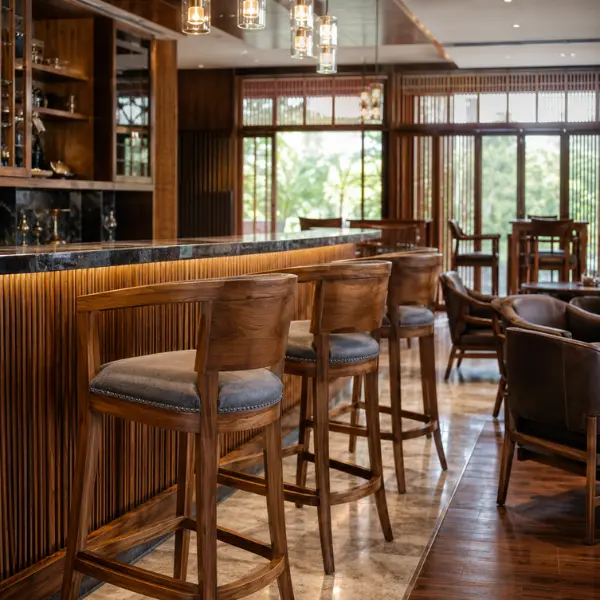 Custom-built solid teak wood bar stools and high tables manufactured for a Bangalore pub.