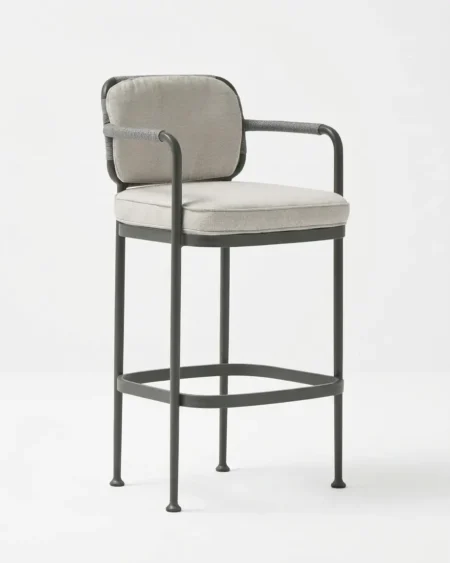 Marine-grade copeland bar stool with grey powder-coated frame, tailored backrest pad, and rope-wrapped armrests