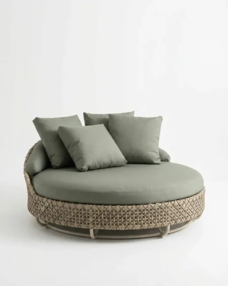 Luxury Corsica wicker round outdoor daybed featuring a rust-proof aluminium frame and UV-stabilized sage green HDPE wicker, manufactured for high-end resorts.