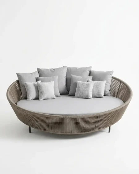 Luxury Fenwick rope round outdoor daybed featuring a rust-proof aluminium frame and UV-stabilized taupe synthetic rope, manufactured for high-end resorts.