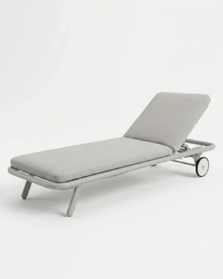 Luxury Halden wheeled sun lounger featuring a rust-proof grey aluminium frame and transport wheels, manufactured for high-end resorts.