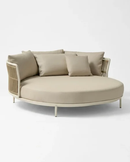 Luxury Ivory rope-panel round outdoor daybed featuring a rust-proof aluminium frame, slim tapered legs, and UV-stabilized ivory synthetic rope, manufactured for high-end resorts.