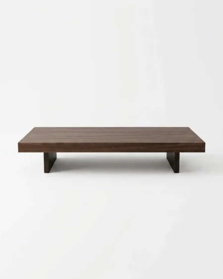 The Kyoto Monolith Wood Center Table featuring a low profile solid walnut wood block top resting on a minimalist sled base.