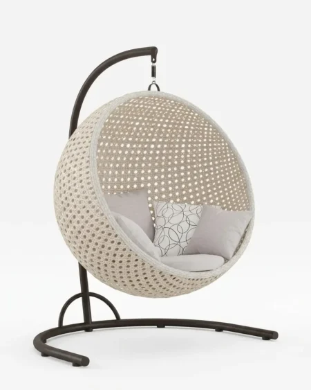 The Luneva Round Wicker Hanging Chair featuring a minimalist ceiling-hung spherical design and premium white wicker weave.