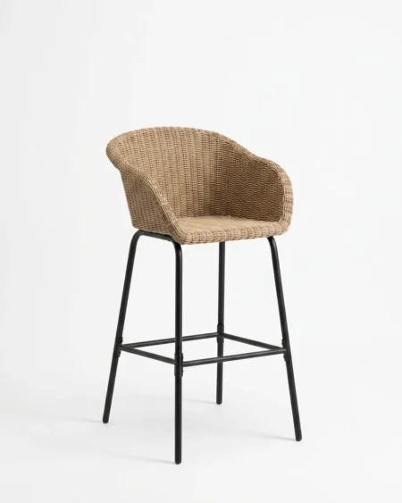 Premium natural tone UV-stabilized wicker Maddox bar stool with black marine-grade aluminium legs and cushionless armchair design for luxury hotels.