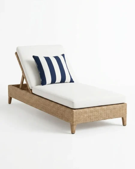Luxury Nautique wicker sun lounger featuring rust-proof tapered aluminium legs and UV-stabilized honey synthetic rattan, manufactured for high-end resorts.