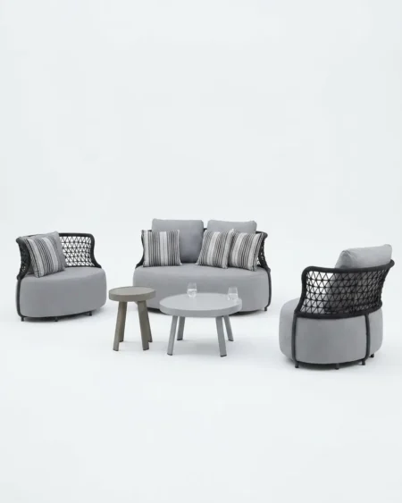 The Nimbus Round Mesh Lounge Set featuring a sophisticated curved silhouette with premium diamond mesh rope weave and a powder-coated metal frame.