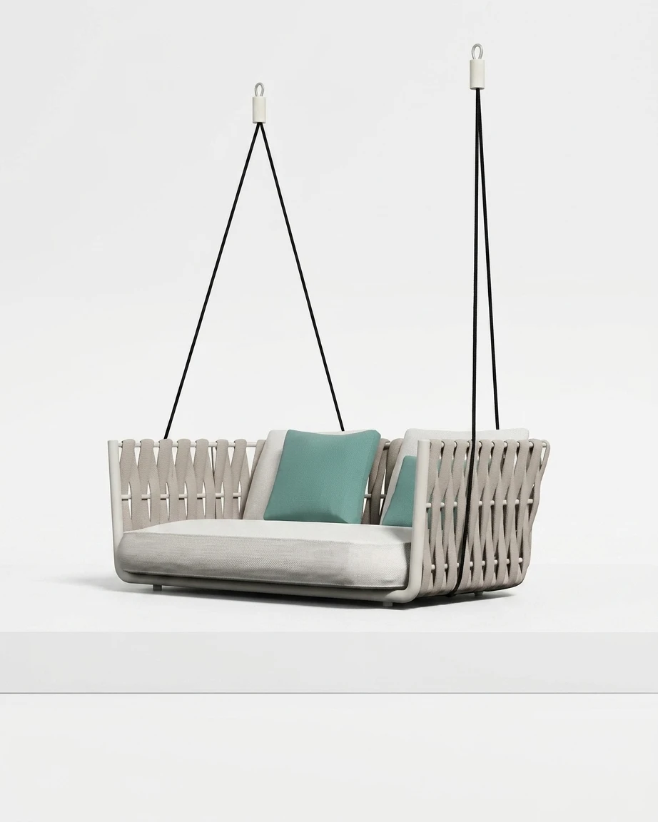 The Riva Woven Hanging Sofa Swing featuring a minimalist two-seater design and premium white rope strap weave.