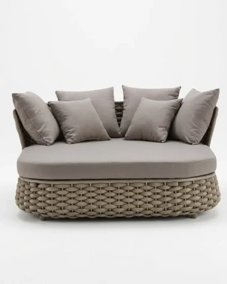 Luxury Sienna woven oval outdoor daybed featuring a rust-proof aluminium frame and UV-stabilized taupe synthetic rope, manufactured for high-end resorts.