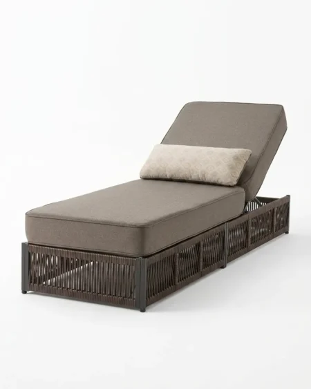 Luxury Tobago wicker sun lounger featuring a rust-proof aluminium frame and geometric panel UV-stabilized dark synthetic rattan, manufactured for high-end resorts.
