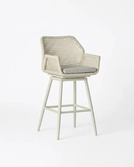 Marine-grade winslow swivel bar stool with beige powder-coated frame and tight wicker grid weave