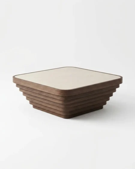 The Ziggurat Marble Center Table showcasing a square natural stone top supported by an Art Deco inspired tiered solid walnut wood base.