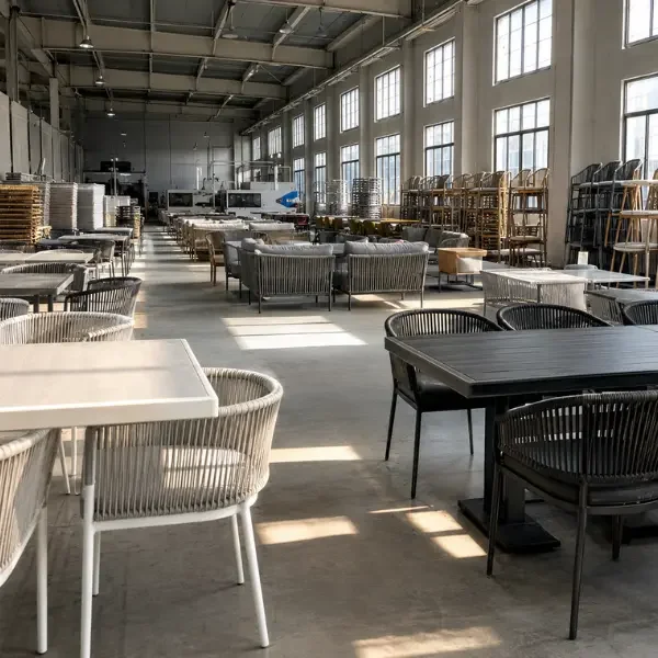 Weatherproof outdoor cafe patio dining tables and chairs for commercial restaurant seating.